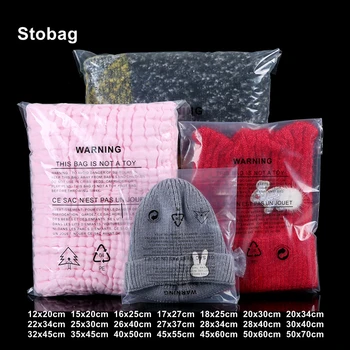 StoBag Прозрачни торби за дрехи, самозалепващи опаковки, пластмасови опаковки, за тениски, за съхранение с предупредителни надписи, запечатани прозрачни торби за еднократна употреба